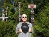 bruce in fossil shirt in front of totem poles